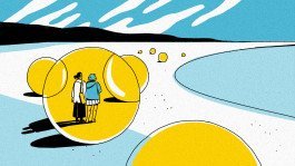 Two people inside a giant bubble standing at the beach, looking out to the ocean. 